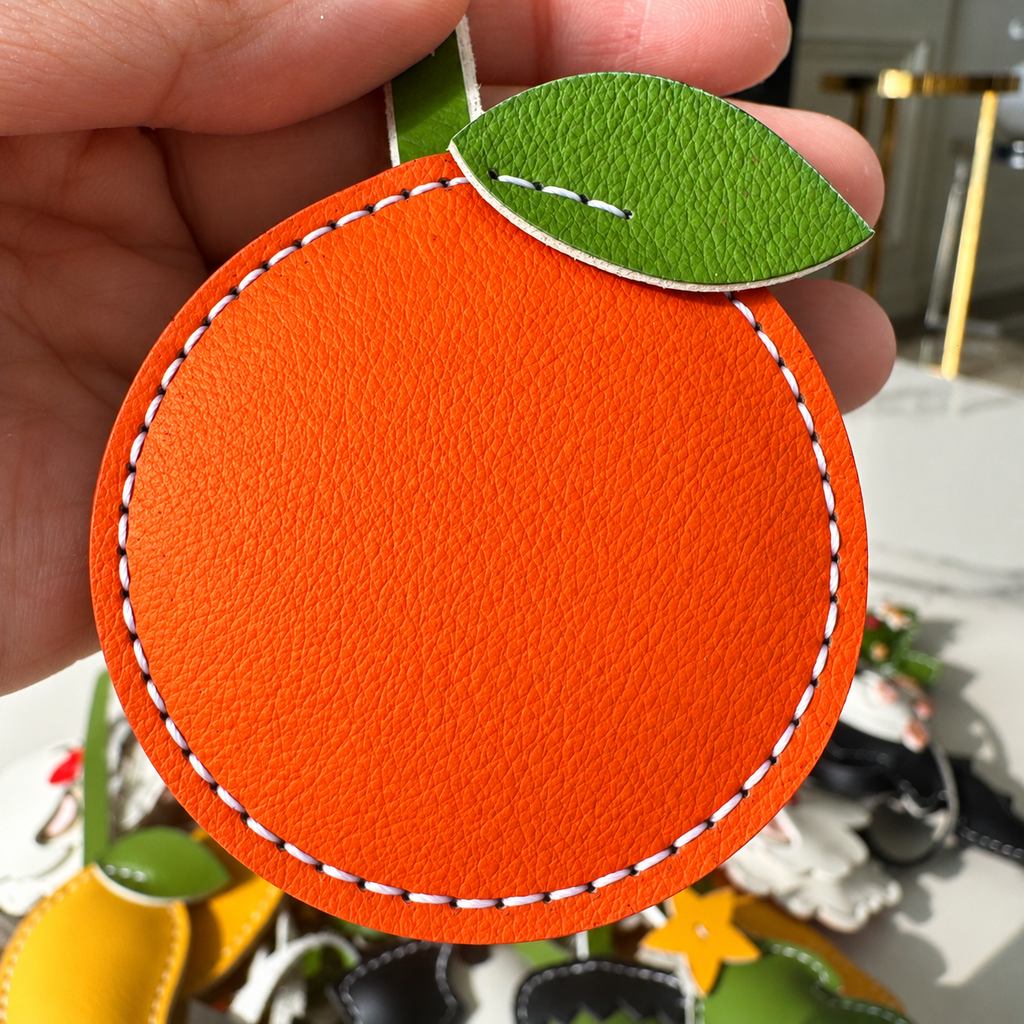 Orange vegan leather bag charm, handmade by Craftelly